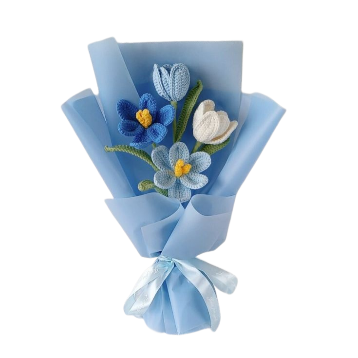 Handmade crochet flower bouquet in Ice Blossom theme featuring blue and white yarn flowers with green leaves