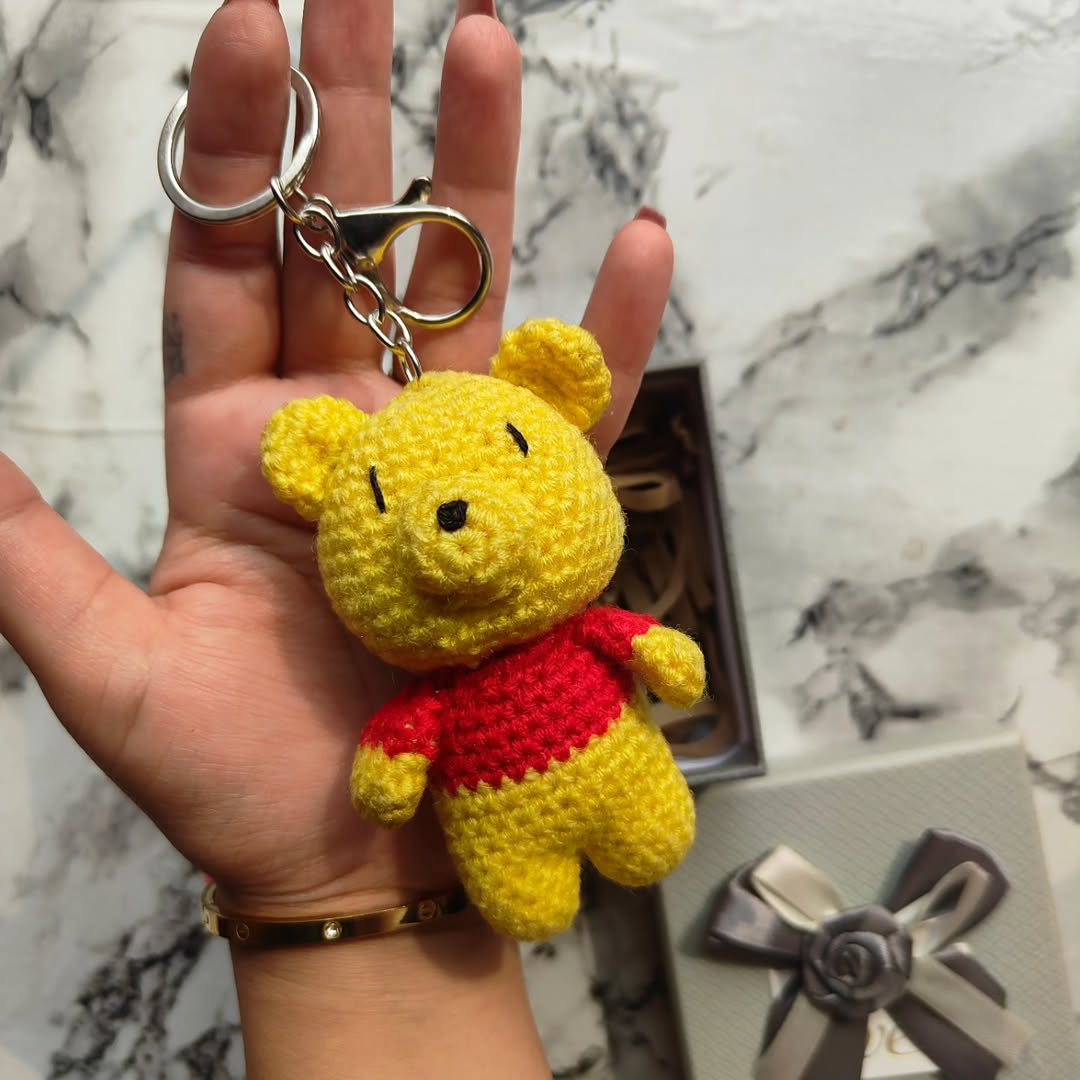 Handmade Winnie the Pooh crochet keychain with red shirt and yellow yarn, amigurumi style bag charm by Art Cart by Swati.